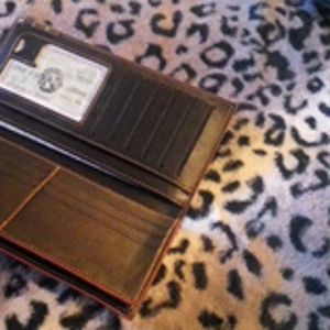 A Black wallet/ phone case.